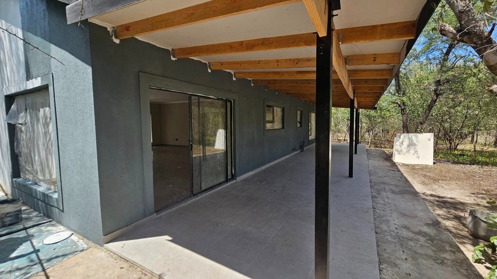 New custom home with timber-beam veranda in the bushveld
